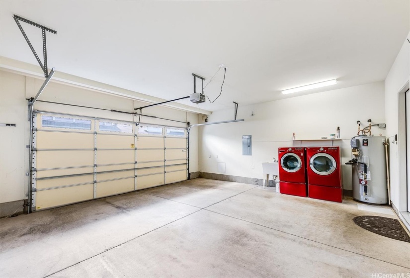 2 car garage with front loading washer & dryer + wash basin & water heater.