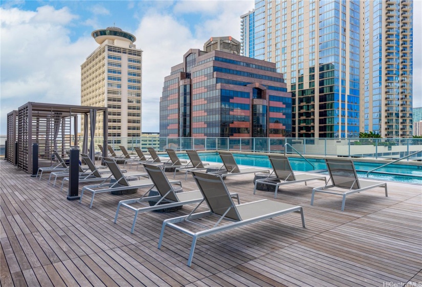 Pool, lounge chairs and cabanas