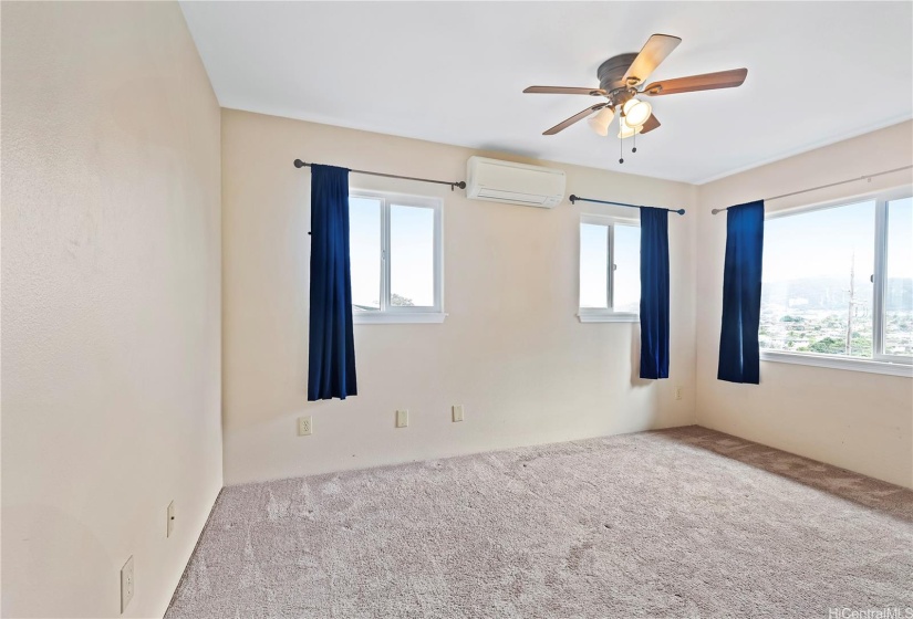 Upstairs bedroom with view of the mountains and street