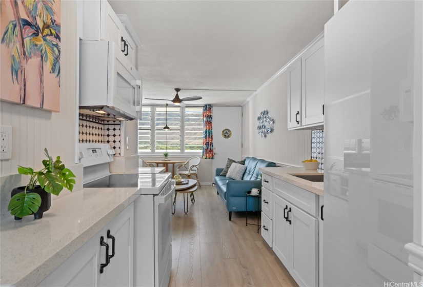 Sleek kitchen with refrigerator and deep freezer