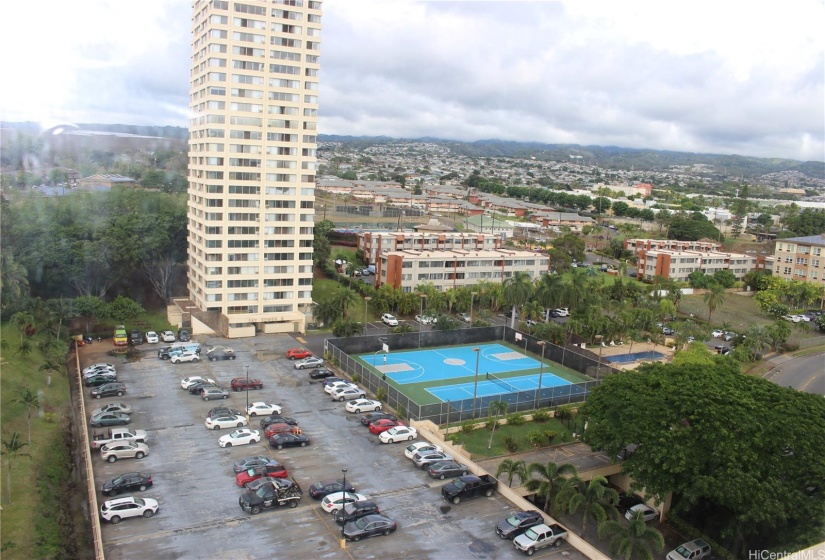Panoramic views from the unit and showing the parking area, tennis/basketball court and the swimming pool.