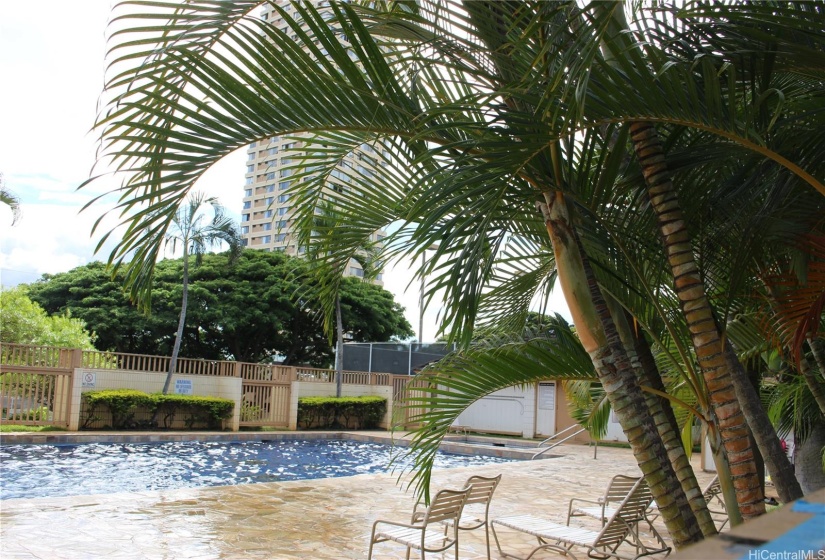 Another view of the swimming pool and partial view of the condo.