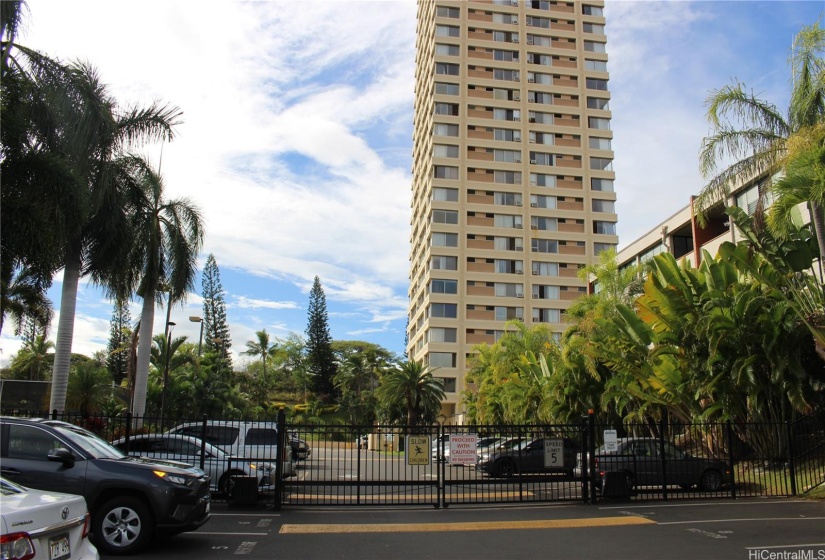 The gate to go inside the condo and beautiful tropical plans surrounding the property.