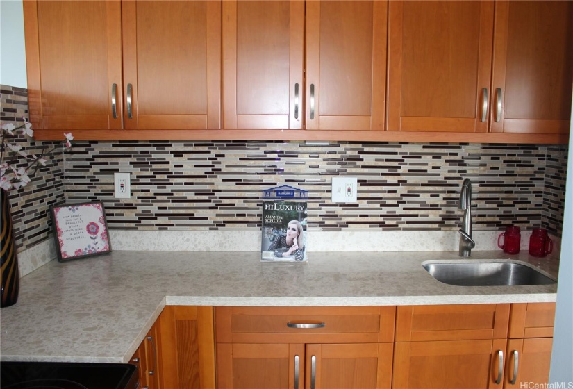Updated kitchen with quartz counter tops.