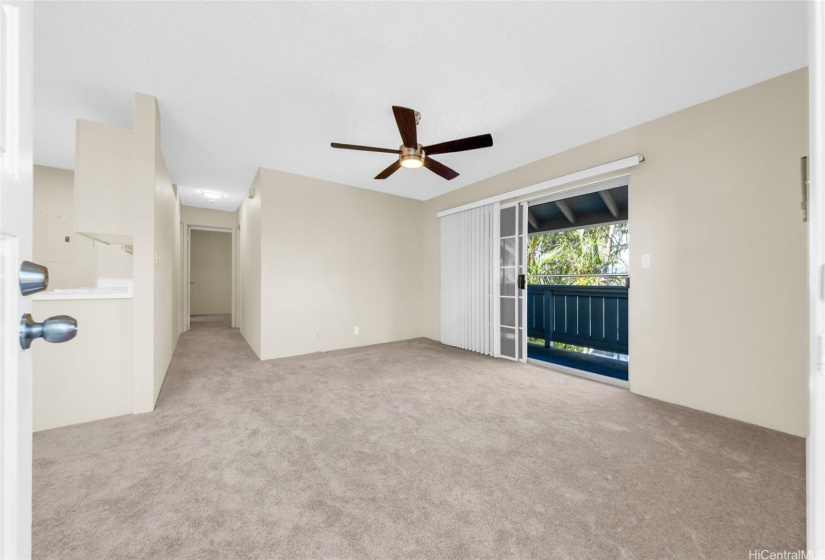 Spacious living area adjacent to outdoor covered patio