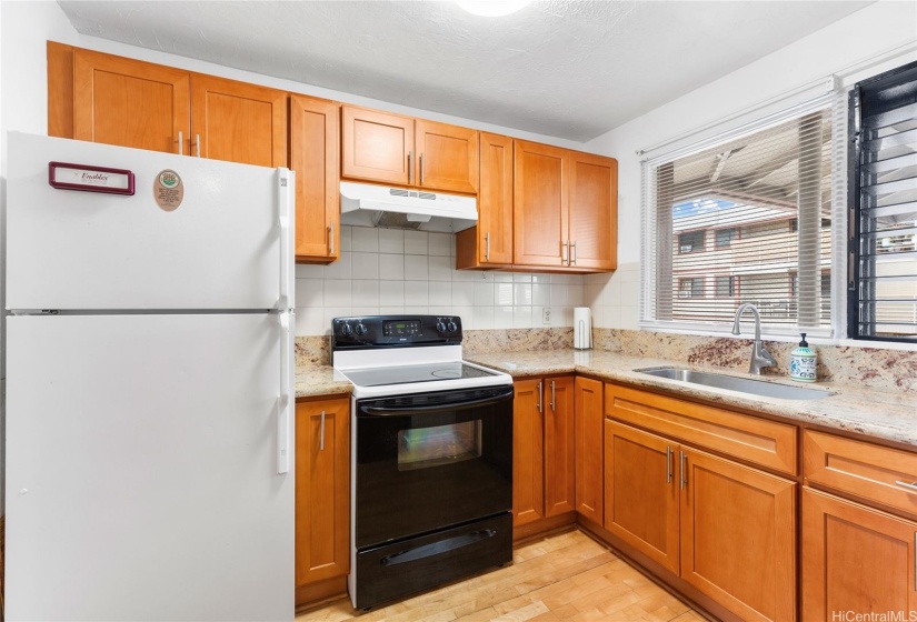 Kitchen with updated cabinets and granite countertops