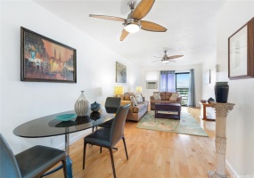 This dining area is spacious and has hardwood floors. It's a great place to entertain guests or enjoy a meal with family.