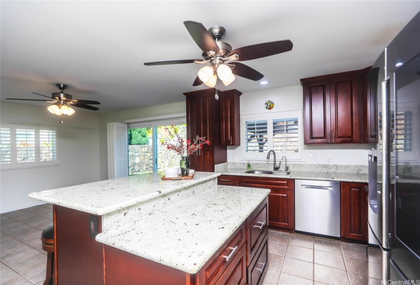 Remodeled kitchen with reverse osmosis water filter on sink and touchless faucet.