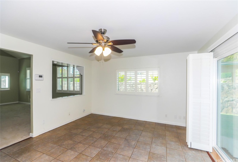 Large dining room that open to backyard and gazebo.