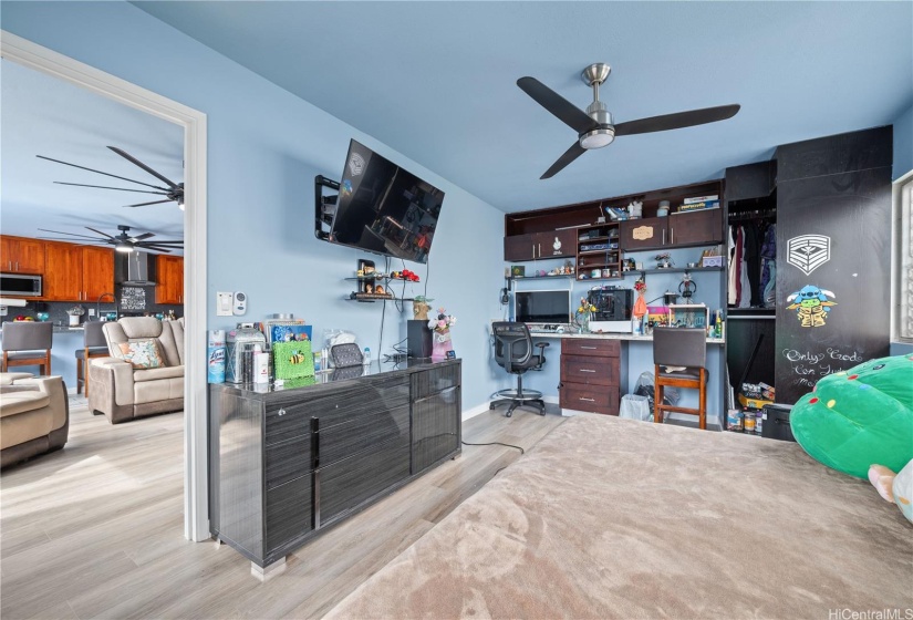 large bonus room off of the living room can be a 4th bedroom.