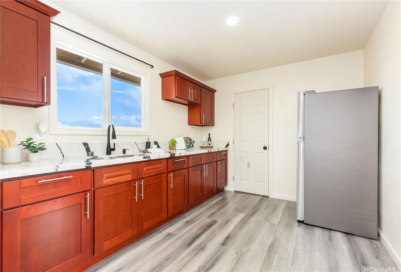 Second floor wetbar with large storage closet near the refrigerator