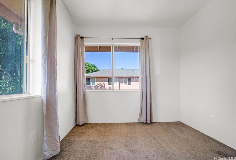 1 of two bedrooms to the right of top of stairs