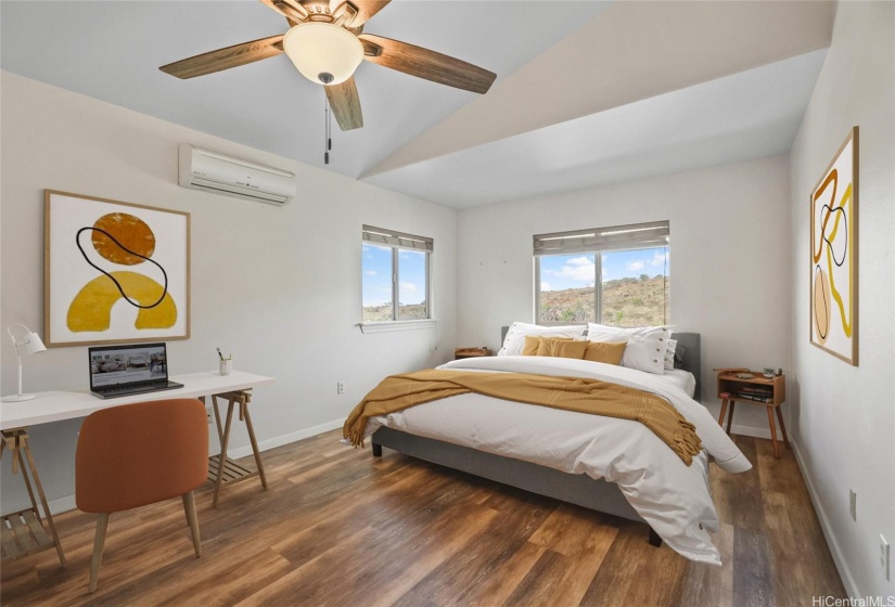 Primary Bedroom with full ensuite bathroom, vaulted ceilings, split AC, and spacious closest.This photo has been virtually staged.