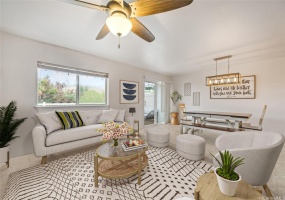 Living Room and Dining Room with access to private yard area. This photo has been virtually staged.