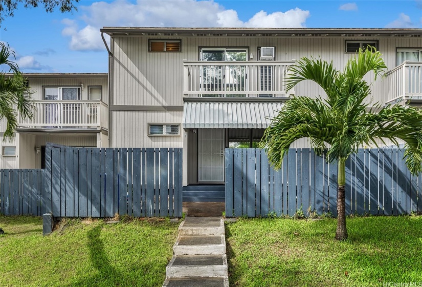The entrance to this home is fully-fenced.