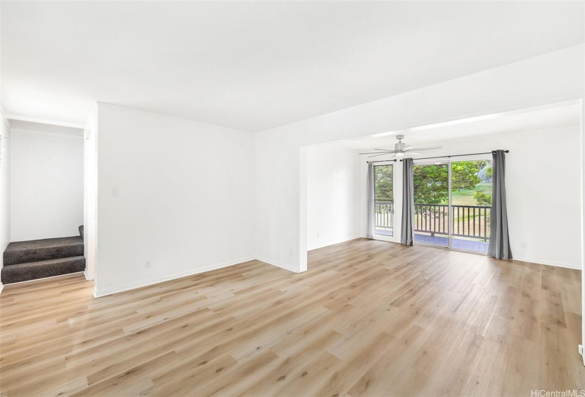 Spacious living and dining rooms with LVT flooring and smooth ceilings