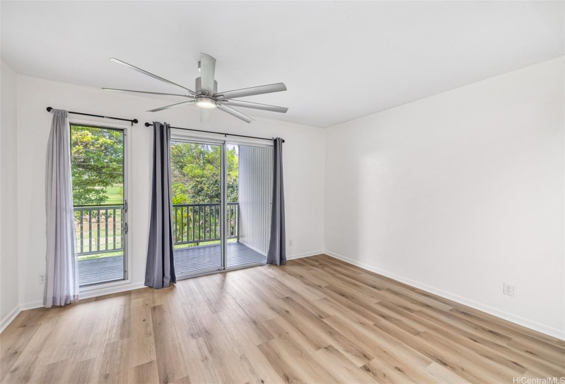 Greenery abounds in your dining room view to the back deck and golf course.