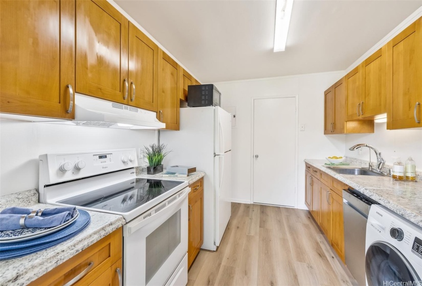 The kitchen is renovated and features a washer, dryer, and dishwasher.