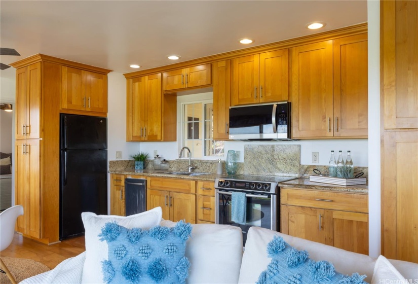 Kitchen has an area that can be converted to a desk.