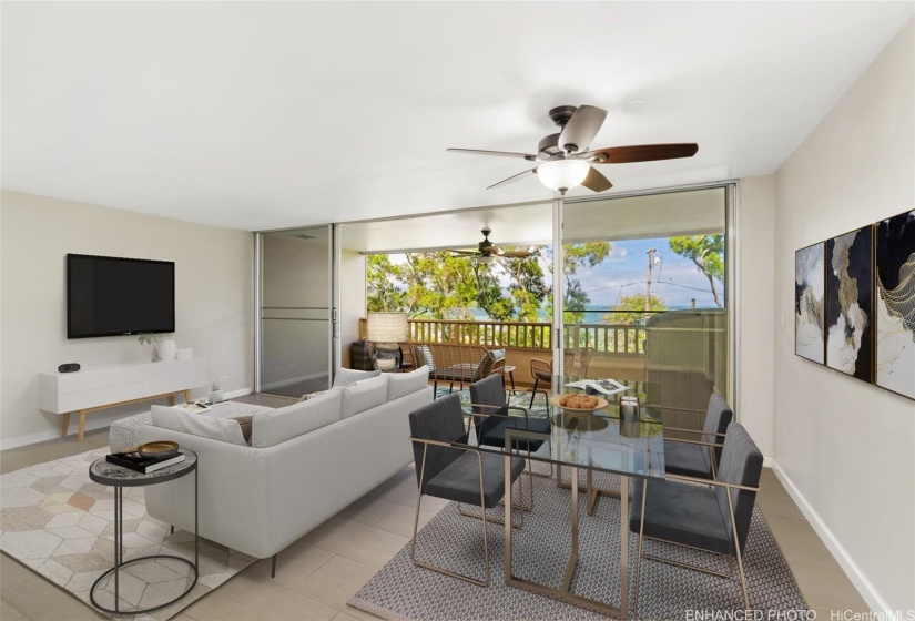 Spacious living room with open concept leading to the lanai. Enhanced: Photo is virtually staged