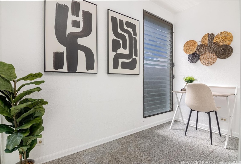 Enhanced Photo. Enclosure adjacent to the kitchen which provides added storage space for your recreational items or can be used as an office, exercise/yoga room.