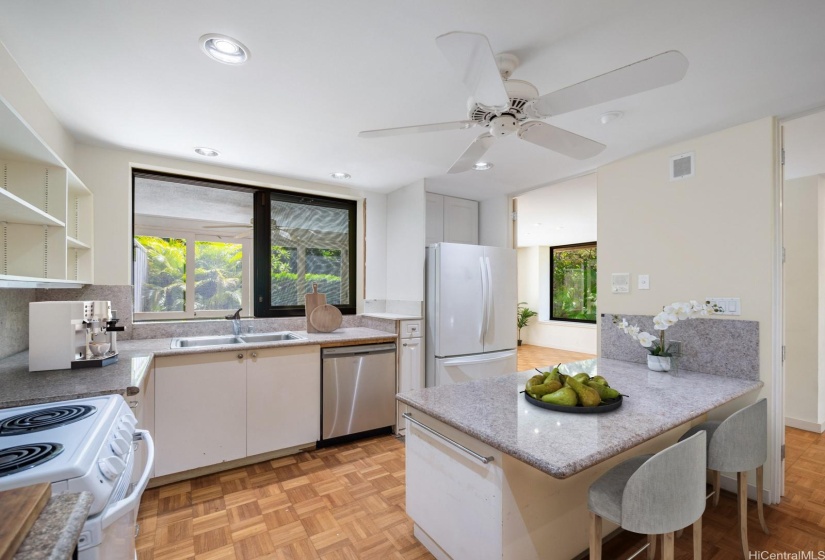 Kitchen with pass-through window to outside living area