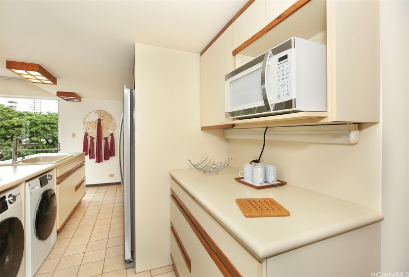 Fully equipped kitchen comes with a brand new refrigerator, new microwave, and ample cabinet storage.