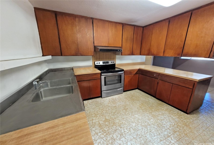 Open concept kitchen connect with dining room overlooking living room.