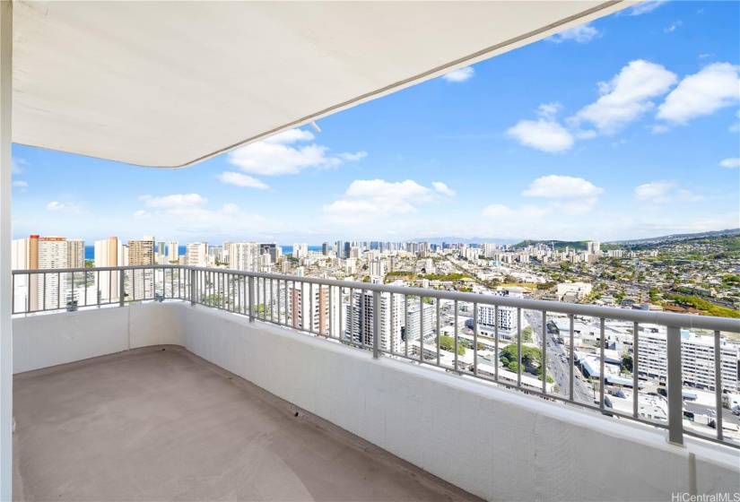 The southwest corner of the wrap around lanai with views of Honolulu city lights