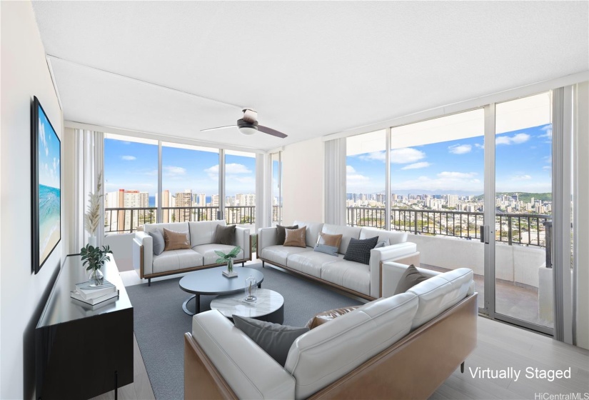 Living room opens up to two sliding doors where you step out to a large wrapped lanai.