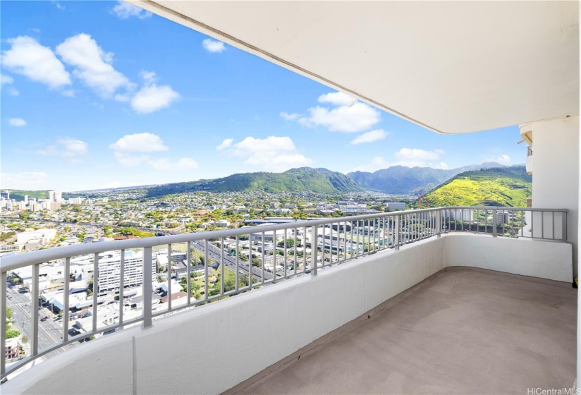 The western portion of the lanai with views out toward the Manoa Valley and Honolulu city lights
