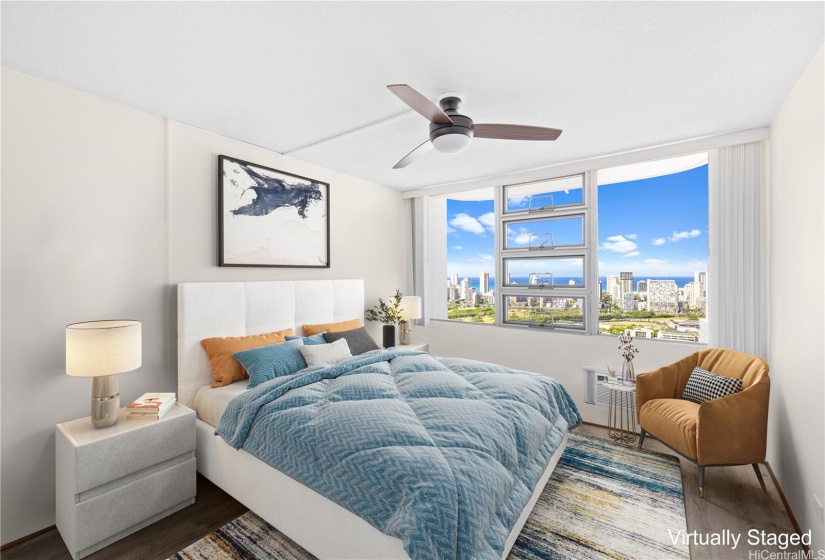 Primary bedroom with both a ceiling fan and window AC option
