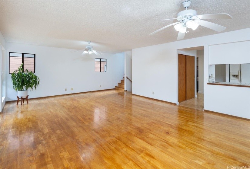 Another look at the living room; the stairs go up to the 3 bedrooms.  The down staircase goes to the garage.