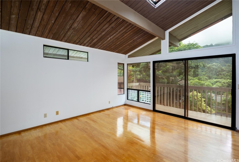 The primary bedroom enjoys the same view as the living room below, and has a deck as well.  This would be a great view to wake up to each morning
