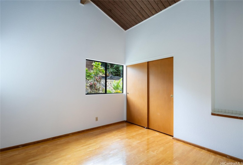 The 3rd bedroom offers a view of the backyard