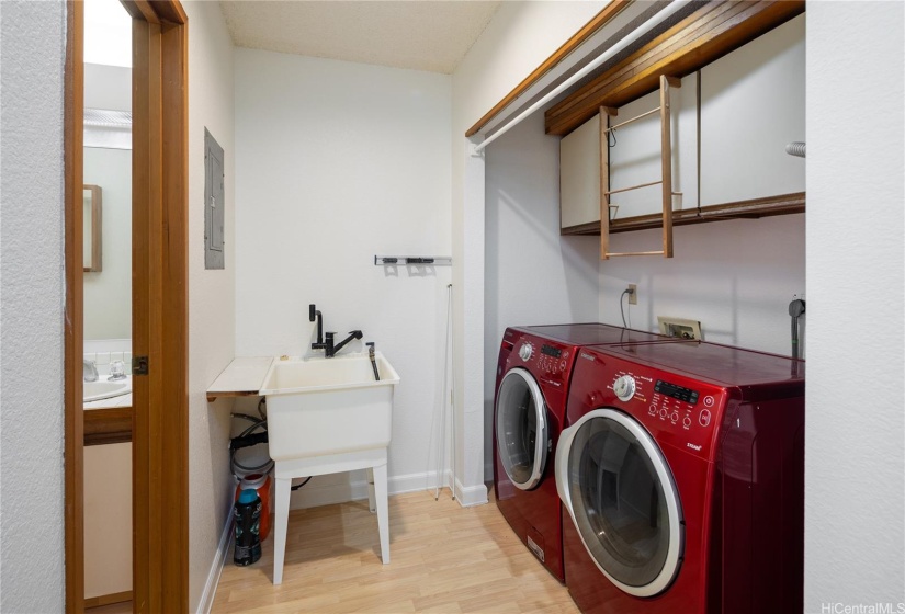 Next to the kitchen is the laundry room and a half bath as well.