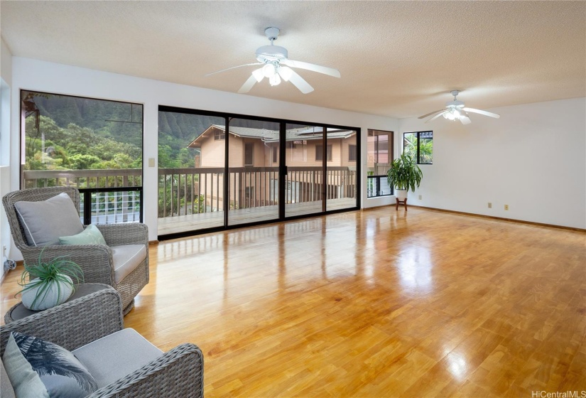 The living room enjoys lovely mountain views and a deck to relax on as well.