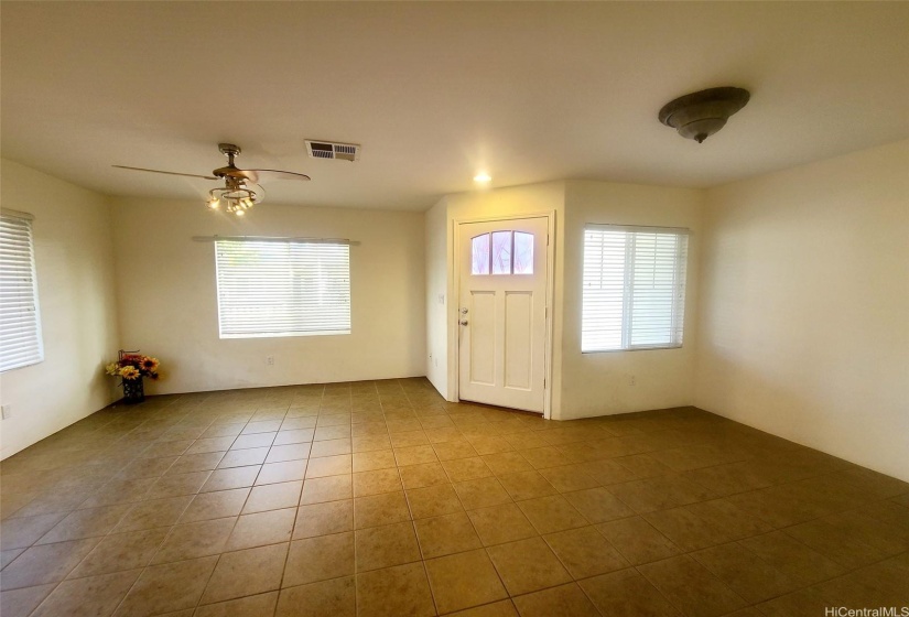 LIVING ROOM HAS CERAMIC TILES & FAN