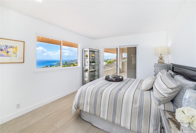 One of the three bedrooms upstairs, which also accesses the covered lanai and the beautiful ocean views from Portlock to Diamond Head.