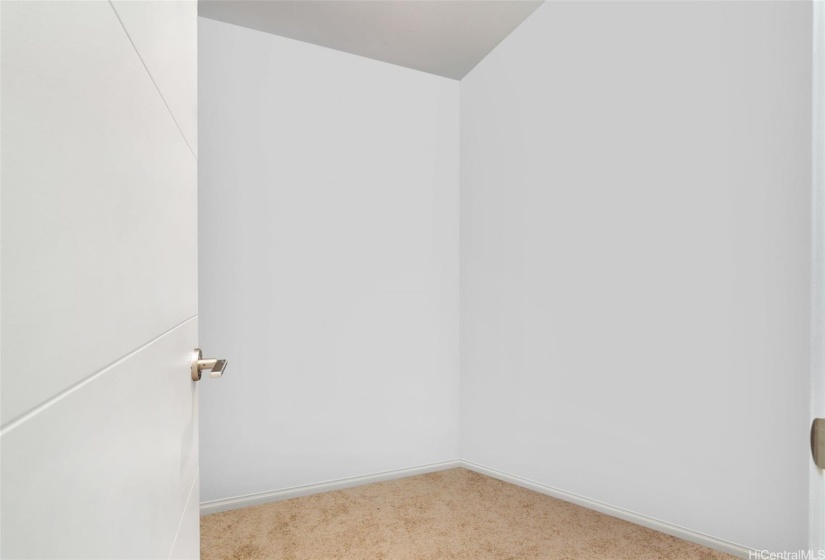 Virtual edited photoPrimary bedroom closet