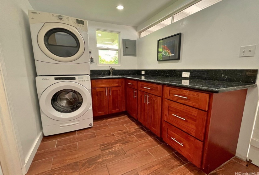 Laundry room that doubles as a wet bar/severving area