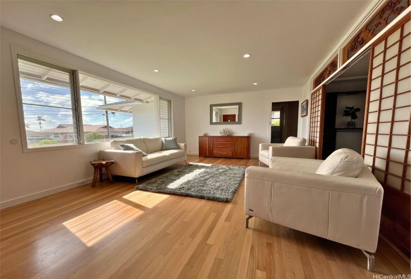Front Living room great for entertaining and sunsets.  Also doubles as a large dinning room.