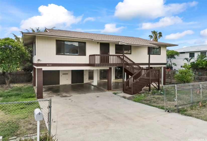 Exterior view of the front of the home with ample parking