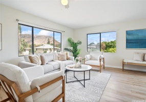 As you enter the home, you are greeted to a large living room