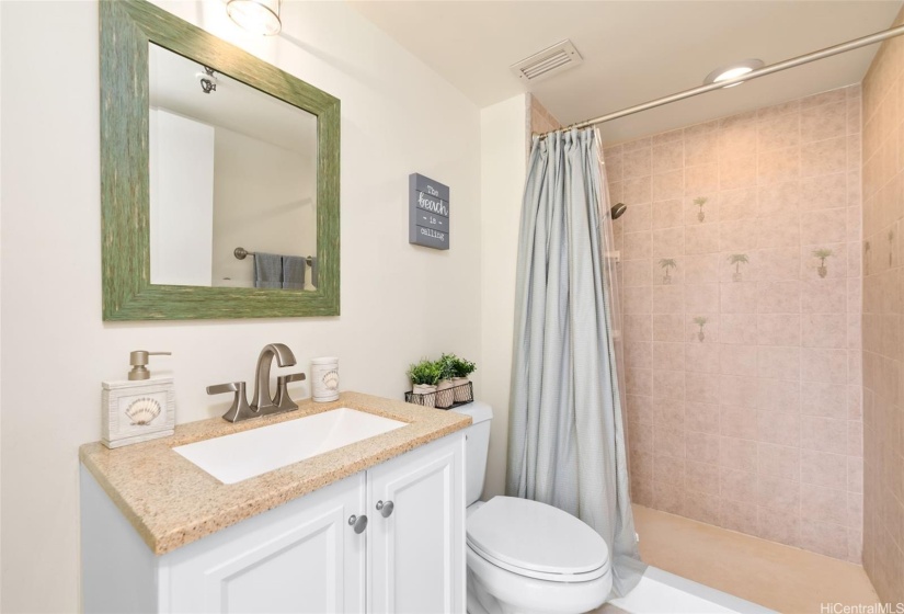 Updated secondary bathroom has a nicely sized shower