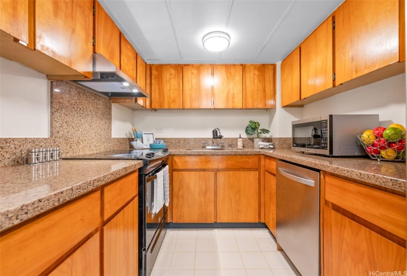 Updated kitchen with a refrigerator, range, dishwasher and wine fridge
