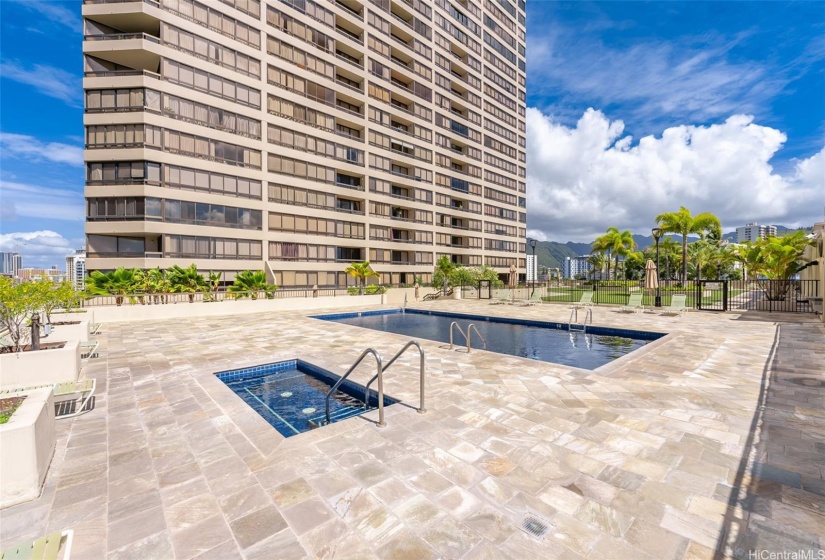 Hot tub is adjacent to the pool