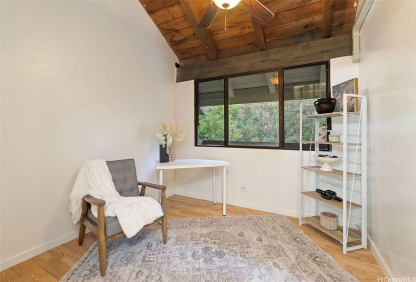 Guest bedroom with soaring ceilings.