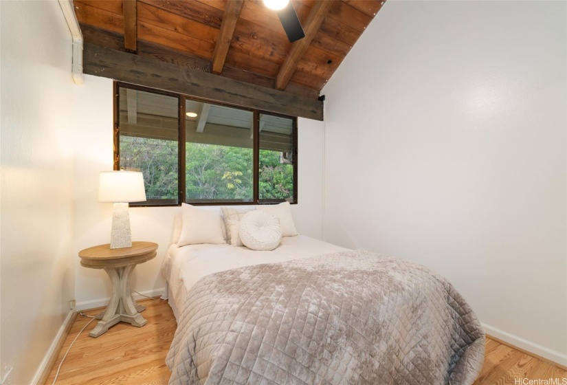 Another guest bedroom with soaring ceilings.