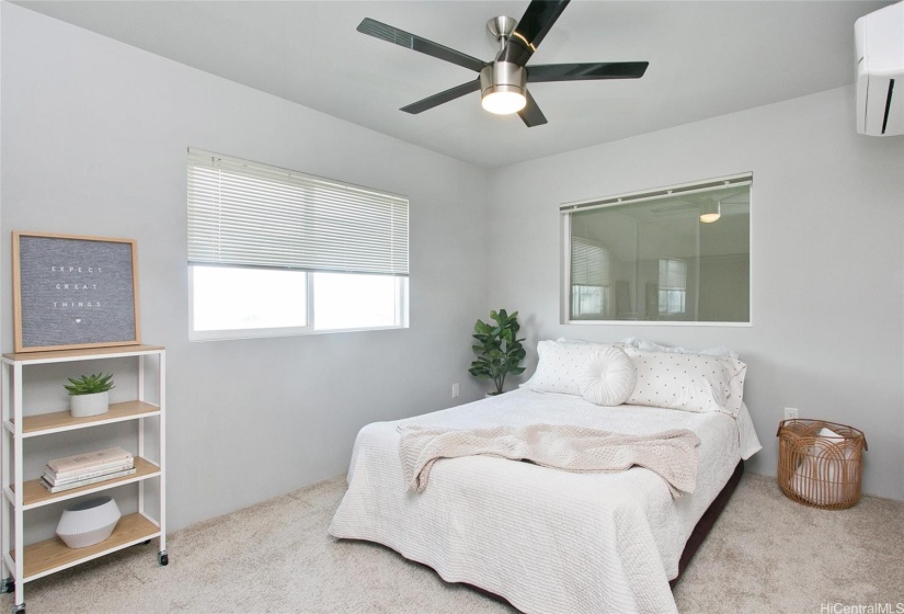 Bedroom 2 with split AC and ceiling fan